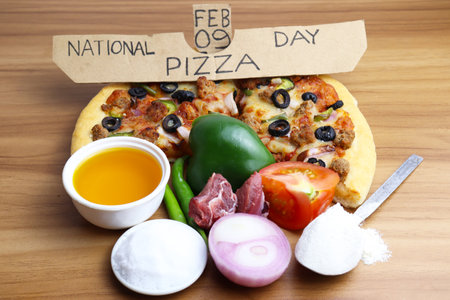 tasty pizza closeup with tomato meat and capsicum for pizza dayの写真素材