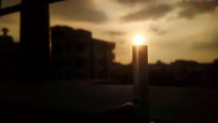 sun on orange sky and evening city viewの写真素材