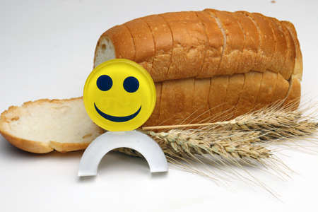 tasty and healthy bread with ripe wheat and smile symbolの写真素材