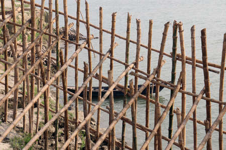 bamboo fence and wall for safety of beach sandの写真素材