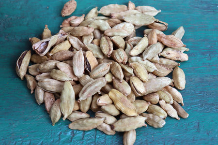 healthy and spicy Green Cardamom stock on wooden background