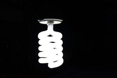 white colored energy bulb closeup on night