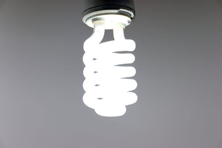 white colored energy bulb closeup on night