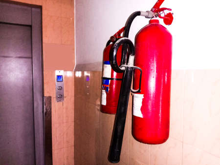 red colored gas cylinder on wall in hospital for fire safetyの写真素材