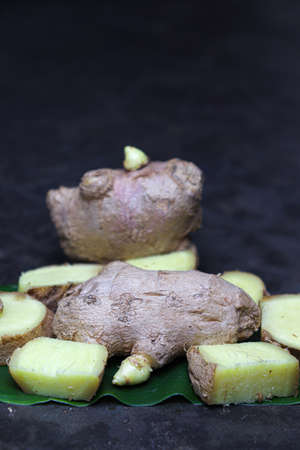 healthy and fresh ginger on leaf for cookingの写真素材