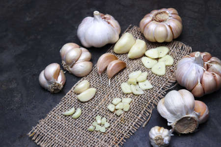 fresh and healthy garlic with cloves stock on kitchen for cookingの写真素材