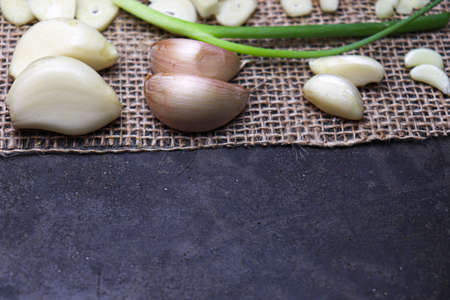 fresh and healthy garlic with tree on kitchen for cookingの写真素材