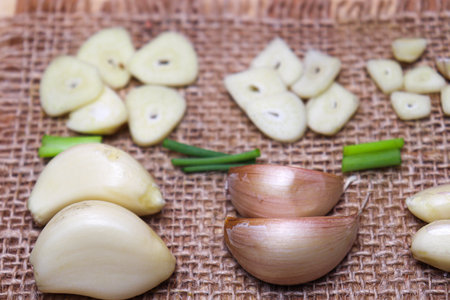 fresh and healthy garlic with tree on kitchen for cookingの写真素材