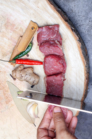 tasty cow beef with spice on chopping board