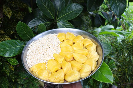 tasty and healthy jackfruit cloves with leaf and puffed rice on plate