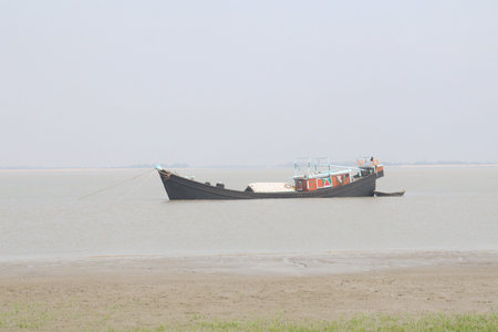 multiple colored wooden fishing boat stock on river