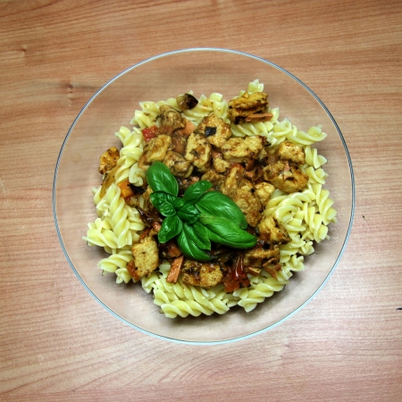 Vegetarian Fake Chicken and Vegetable Pasta in a glass bowlの写真素材