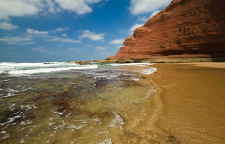 huge red cliffs on the beach Legzira  Morocco の写真素材