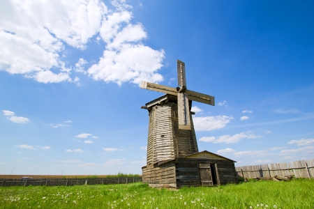 old wooden windmill in russian villageの写真素材