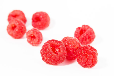 Fresh raspberries isolated on white background