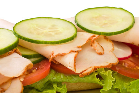 Roasted turkey sandwich with lettuce, cucumbers and tomatoesの写真素材