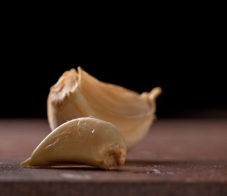 Close view of two peeled garlic clovesの写真素材