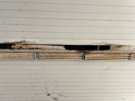 metal door with corrugated iron plate and rust