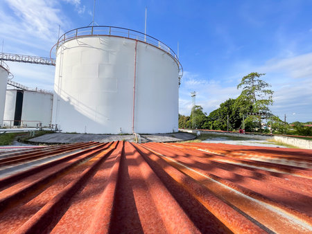 Oil tank in oil refinery plant with blue sky and cloud for backgroundの写真素材