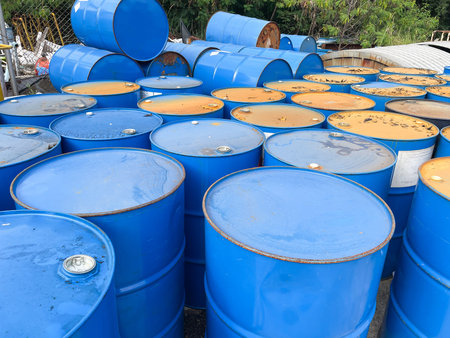 Oil barrels in the oil field, closeup of photo with selective focus