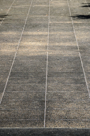 Pathway from the granite floor plates at public park in Thailand.