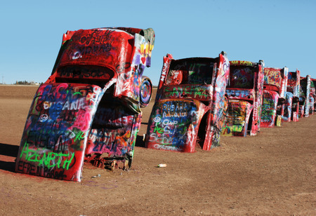 some old cars buried in the landの写真素材