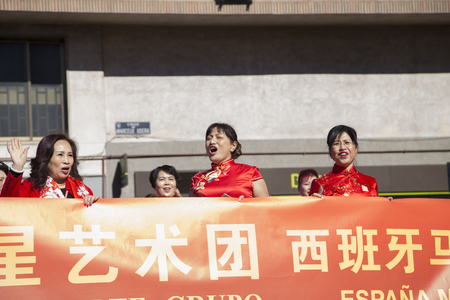 Madrid, Spain, Chinese New Year parade in the neighborhood of Usera, 18-February-2018, Children, ladies bannerのeditorial素材