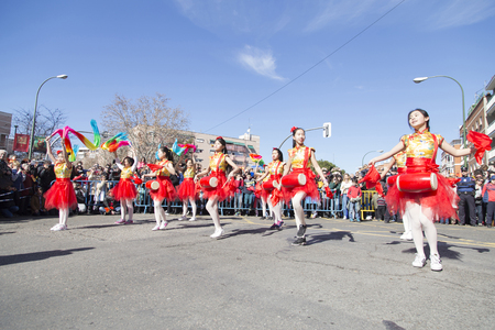 MADRID, SPAIN - FEBRUARY 18th 2018: Chinese New Year parade in the Usera neighborhood, 18-February-2018, girls dancing ribbonsのeditorial素材