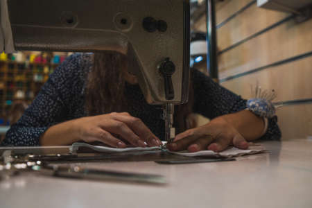 Shop assistant working in clothing storeの写真素材