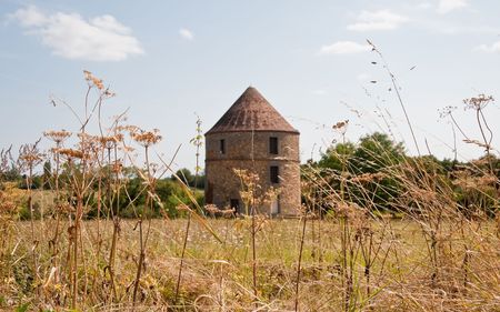 Round brick building with conical roofの写真素材