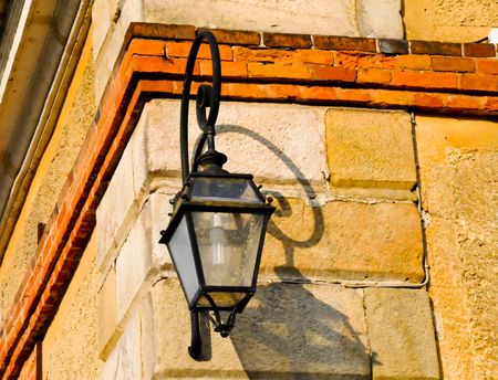 Lamp on sunlit buildingの写真素材