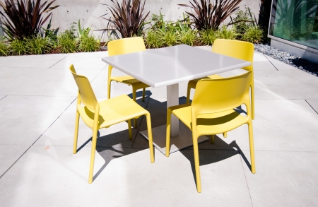 Sunlit chairs and tableの写真素材