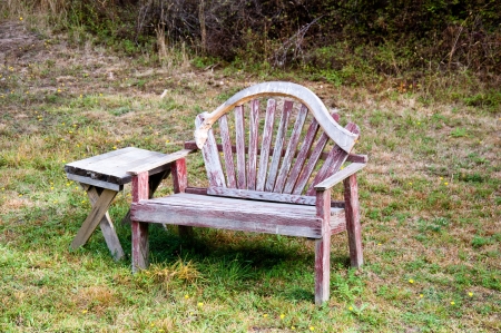 Old bench and table in a fieldの写真素材