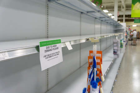 Atlanta, GA / USA - 04/02/20: Empty grocery store shelves at Publix fully out of stock of all supplies including toilet paper, paper products, and bathroom essentials during Covid-19 Corona Virusのeditorial素材
