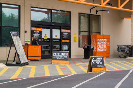 Kennesaw, GA / USA - 04/05/20: Curbside pickup and social distancing signs outside the Home Depot...