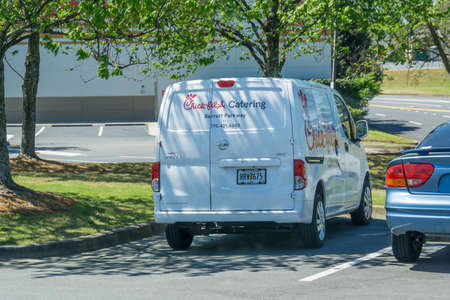 Kennesaw, GA / USA - 04/02/20: White Chick-fil-a caterting van parked in Kennesaw, GA on Barrett Parkway.のeditorial素材