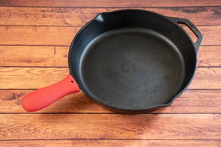 Silicone Hot Skillet Handle Cover Holder - Insulating kitchen accessory protects hands from hot pan handles. heat-resistant silicone creates insulating layer of protection. Oven safe.の写真素材