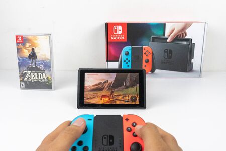 Playing Zelda breath of the wild in Nintendo Switchのeditorial素材