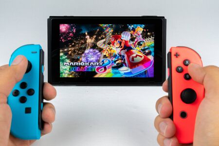 Playing Mario Kart Deluxe 8 in Nintendo Switchのeditorial素材