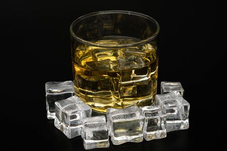 Whiskey in the rocks, Glass of whiskey with ice cubesのeditorial素材
