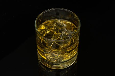 Whiskey in the rocks, Glass of whiskey with ice cubesのeditorial素材
