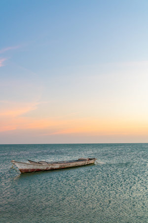 Landscape of paradise tropical beach, sunrise, sunset shot, with a boat