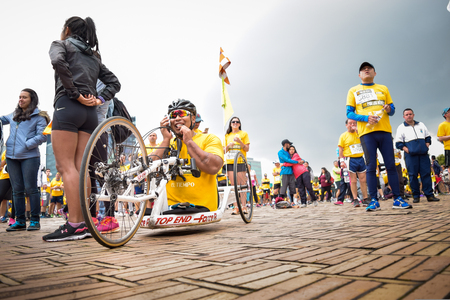 Bogota Colombia. (May 06, 2018). A HandCycle athlete, at the end of the race, he happily calls his family by phoneのeditorial素材