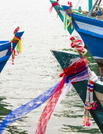 Header of fishing boats, colorful fabric on header of fishing boats on the beliefs of the native Thailand の写真素材