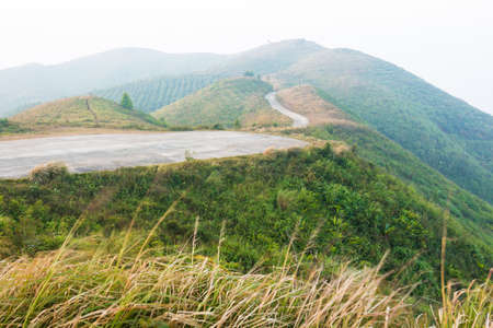 Mountains at sunrise on foggy day の写真素材