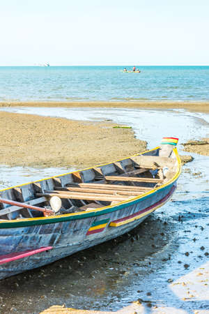 Beach with fishing boats on the seaの写真素材