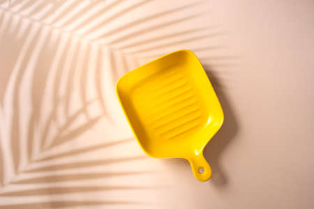 Empty plates on the Leaf shadowの写真素材