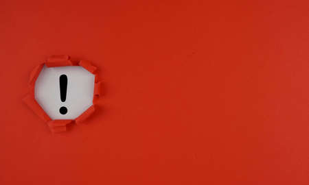 Red torn paper with copy space and question mark on white background. Exclamation mark concept ..の写真素材