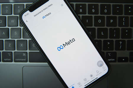 Rawang, Malaysia - OCT 28, 2021: Facebook social media rebrand app known as Meta on iPhone 12 screen. Facebook has changed its corporate name to Meta as part of a major rebrand.のeditorial素材