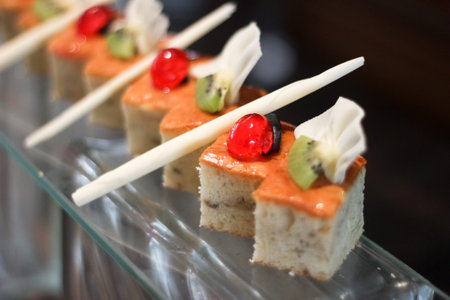 row of cherry cakes with white and dark chocolate